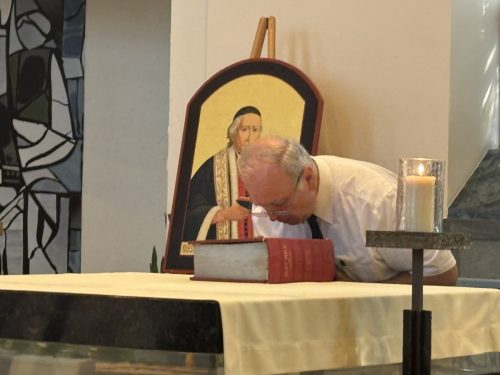Bro. Joseph, provincial, kisses the Bible as he re-affirms his perpetual vows.
